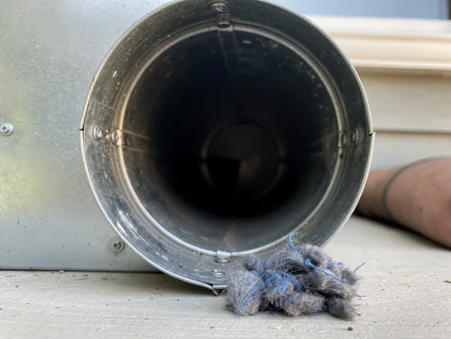 Solon Dryer Vent Cleaning technician using specialized equipment to clear severe dryer vent blockage in Solon